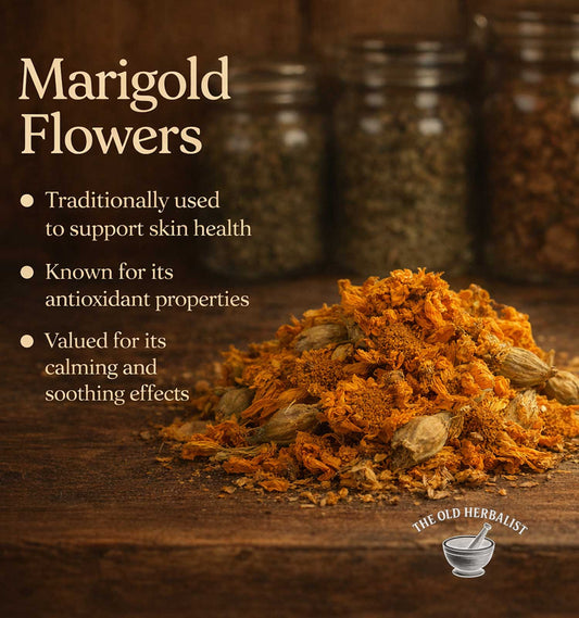 Dried marigold flowers on a wooden surface with text about their uses, set against jars of herbs.