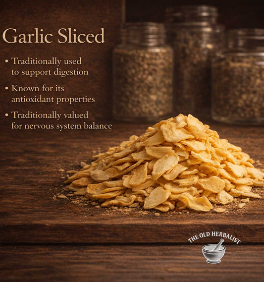 Sliced garlic on a wooden surface with text about its uses and The Old Herbalist logo.