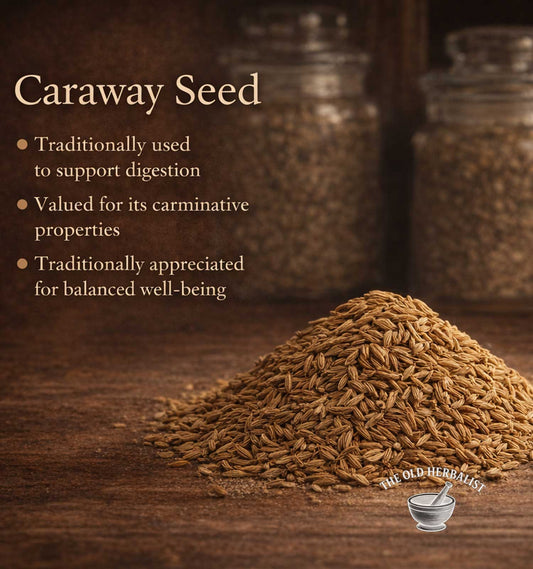 Caraway seed with text about its uses on a wooden surface, featuring The Old Herbalist logo.