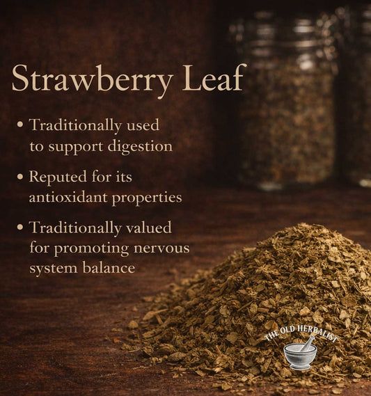 Strawberry leaf powder on a wooden surface with text about its uses.
