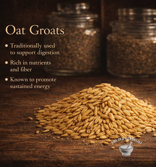 Oat groats on a wooden surface with text about their benefits and The Old Herbalist logo.