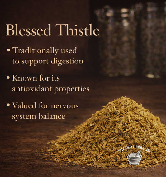 Blessed Thistle on a wooden surface with text about its uses.