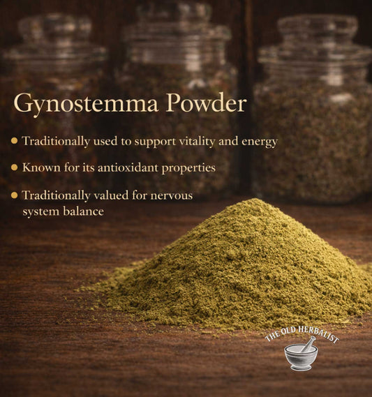 Gynostemma powder with text about its uses on a wooden surface, branded as 'The Old Herbivist'.