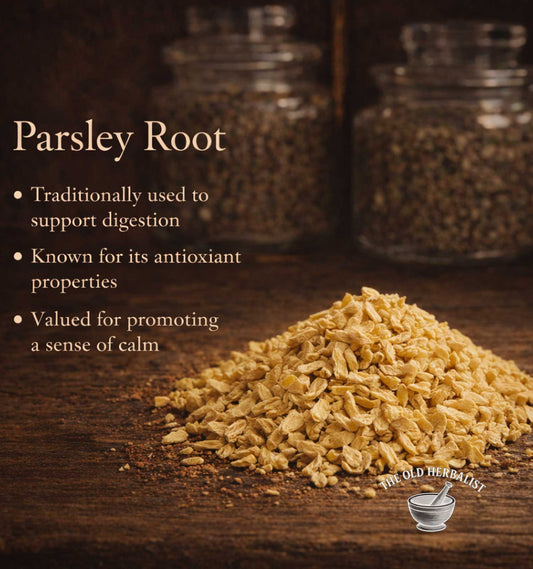 Parsley root on a wooden surface with text about its uses and The Old Herbalist logo.