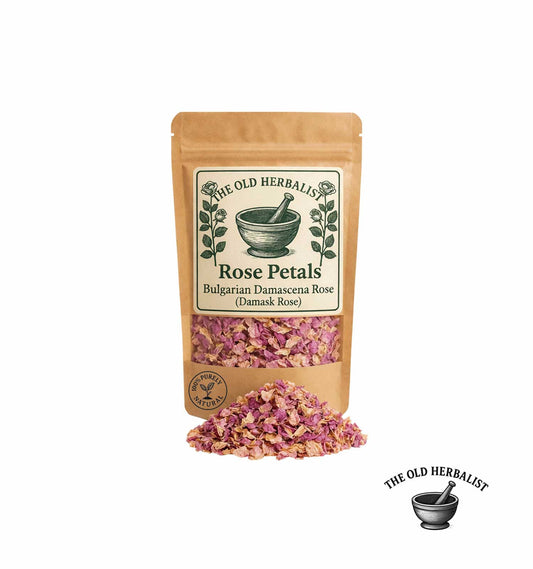 Bag of rose petals with a label on a white background, featuring 'The Old Herbalist' brand.