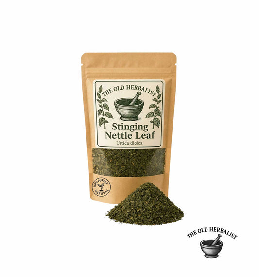 Package of 'The Old Herbalist' Stinging Nettle Leaf with a pile of dried leaves on a white background.