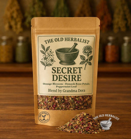 Secret Desire herbal tea blend with rose petals, mint, and orange blossom in kraft pouch.
