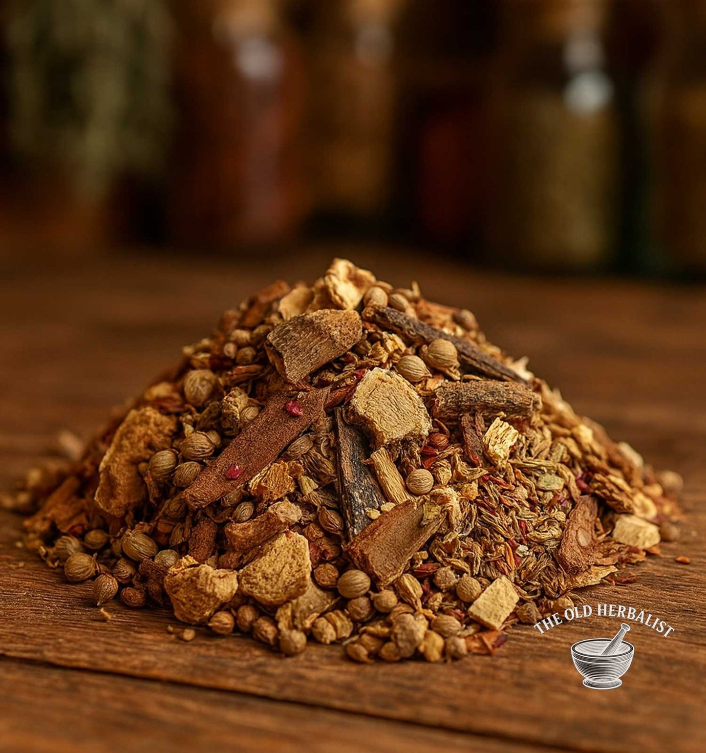 Loose herbal spice tea blend with cinnamon, anise, and citrus peel on wooden surface.