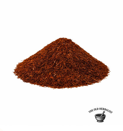 Loose rooibos tea leaves with rich red color – caffeine-free herbal tea.