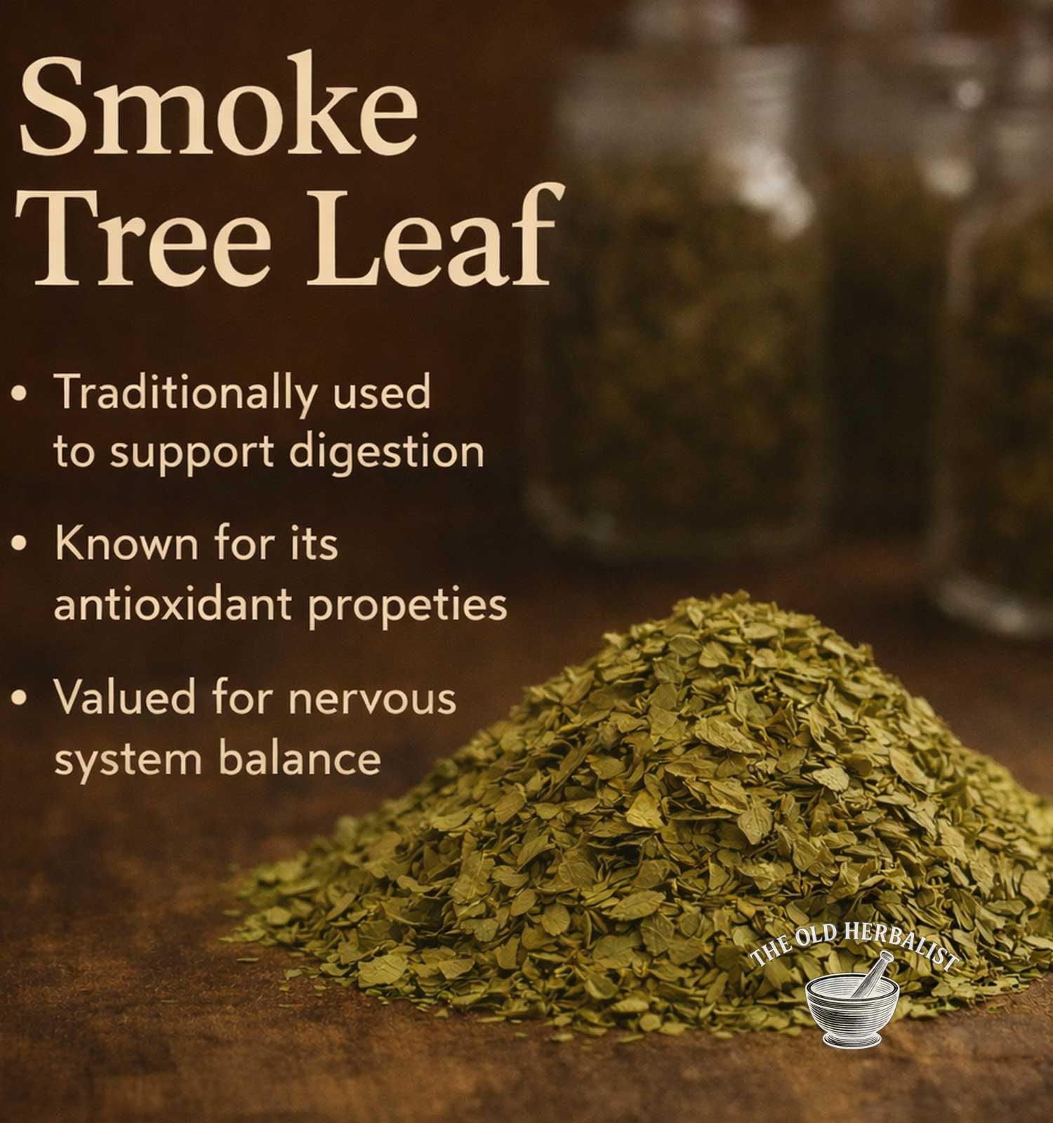 Heap of smoke tree leaf with text about its uses on a wooden surface, featuring The Old Herbary logo.