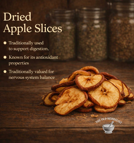 Dried apple slices on a wooden surface with text about their health benefits and The Old Herbalist logo.