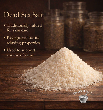 Dead Sea Salt on a wooden surface with text about its uses, branded 'The Old Herbalist'.