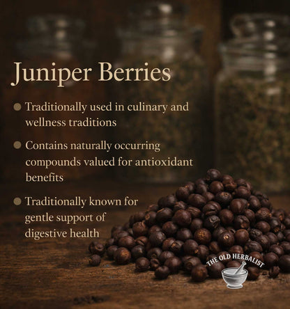 Juniper berries with text about their uses on a wooden surface, featuring The Old Herbalist logo.