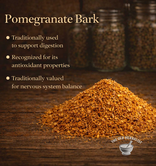 Pomegranate bark on a wooden surface with text about its uses and The Old Herbalist branding.
