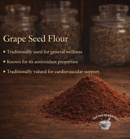 Grape seed flour with text about its uses on a wooden surface, branded as 'The Old Herbalist'.