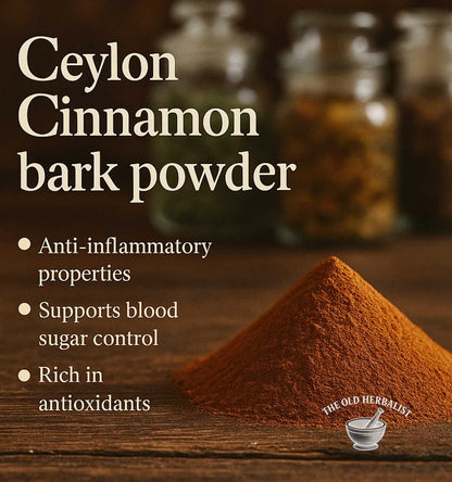 Ceylon cinnamon bark powder with text about its benefits on a wooden surface, branded as 'The Old Herbalist'.