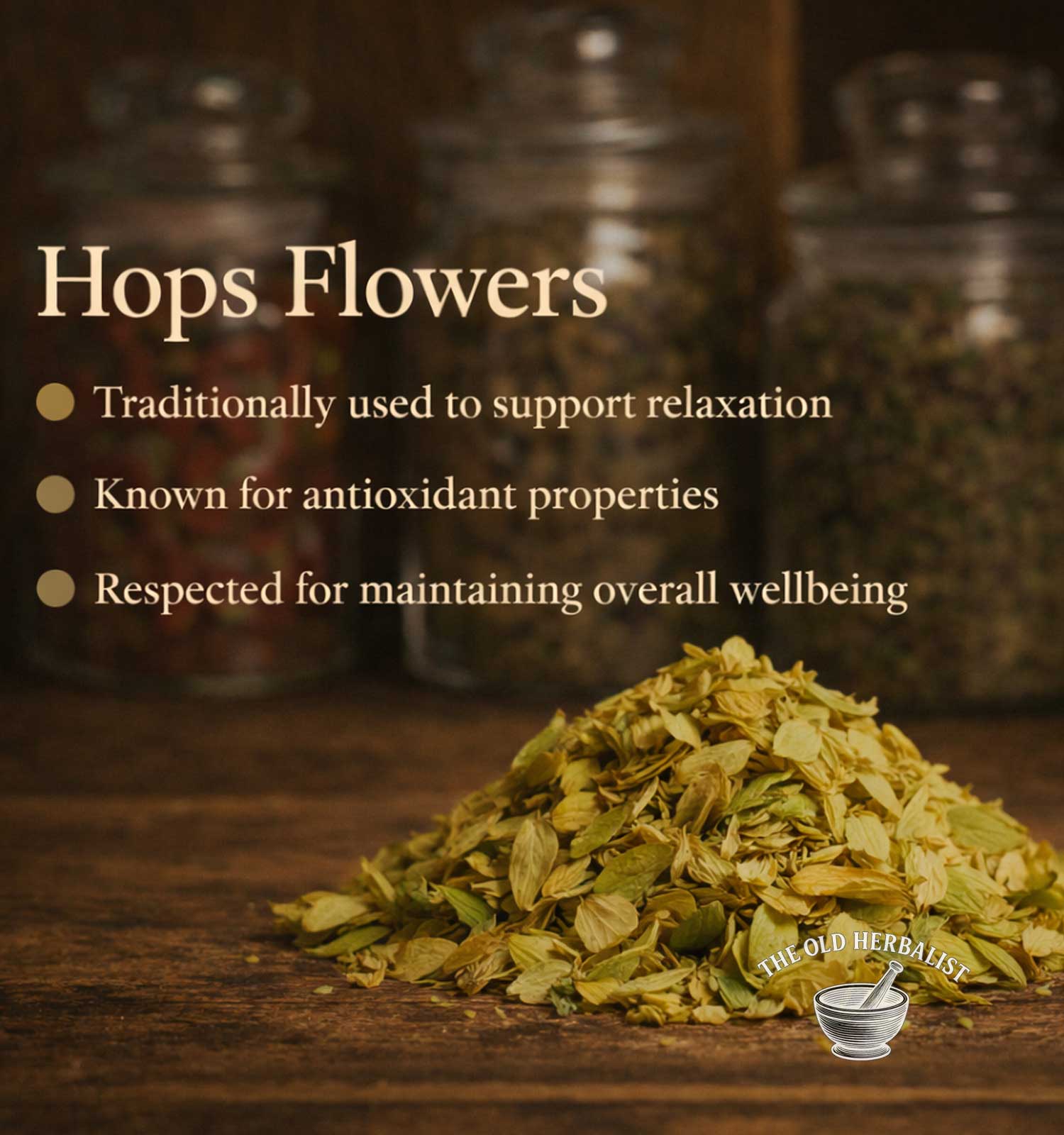 Hops flowers on a wooden surface with text about their uses, set against a blurred background of jars.