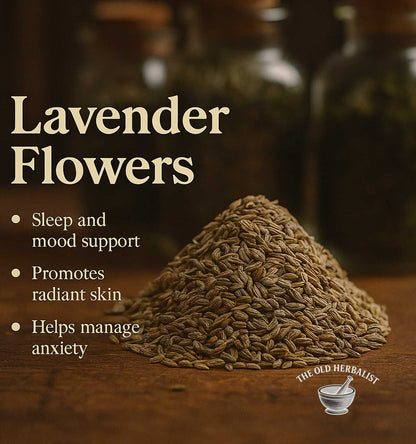 Heap of dried herbs with text about lavender flowers' benefits on a wooden surface.