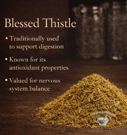 Blessed Thistle on a wooden surface with text about its uses.