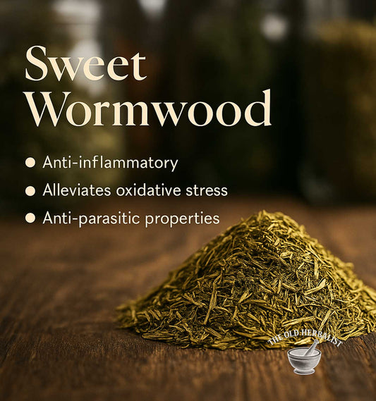 Heap of sweet wormwood on a wooden surface with text highlighting its properties.