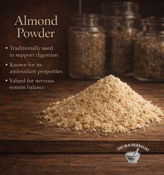 Almond powder on a wooden surface with text about its benefits and 'The Old Herbalist' branding.