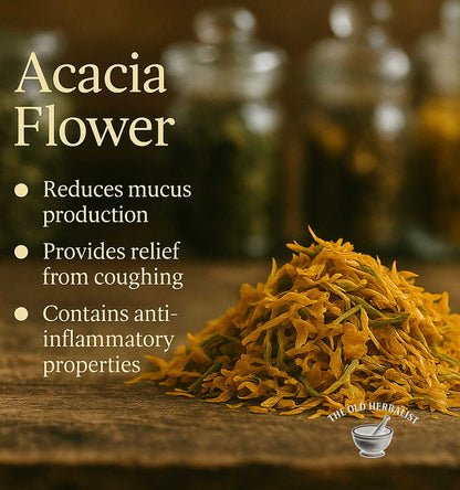 Acacia flower with text about its health benefits on a wooden surface.