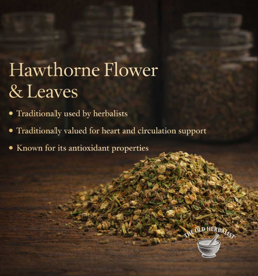 Hawthorne flower and leaves with text about their uses on a wooden surface, featuring The Old Herbalist brand.