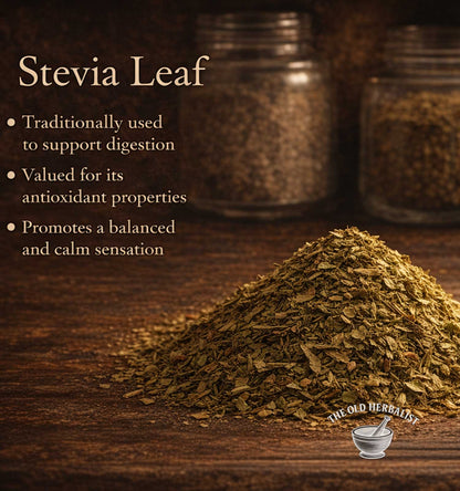 Stevia leaf on a wooden surface with text about its uses and 'The Old Herbalist' logo.