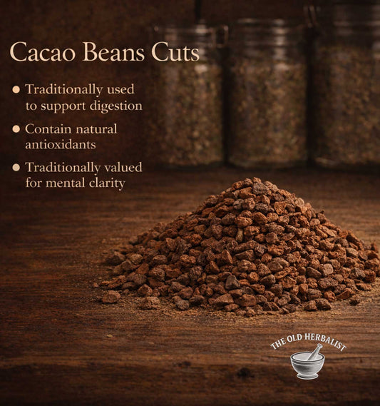 Cacao beans cuts on a wooden surface with text about their benefits and The Old Herbalist logo.